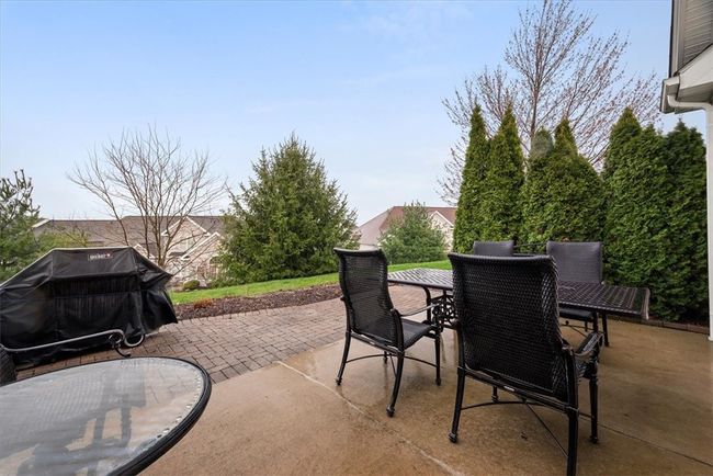 The tree lined back yard provides privacy while you relax with a glass of that cold lemonade on your back patio. | Image 14