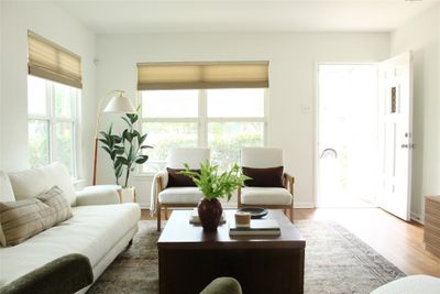 Beautiful light & windows in the living room and entrance. | Image 2