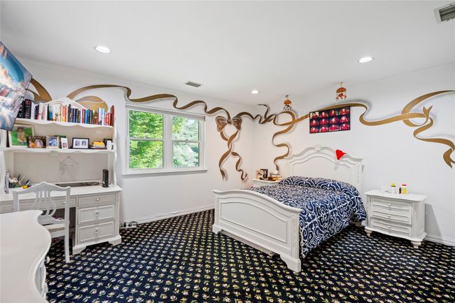 Bedroom featuring dark carpet, an office area, crown molding, recessed lighting, and baseboards | Image 16