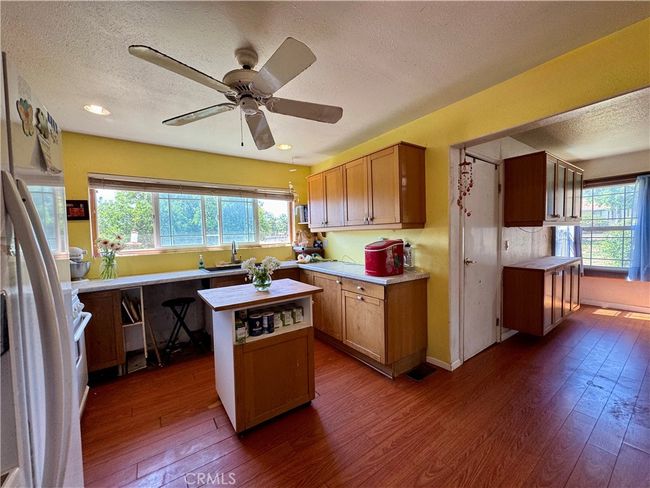Kitchen opens to Family room and Dining rooms | Image 23