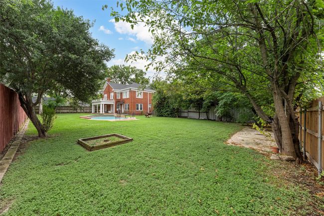 View of fenced backyard | Image 38