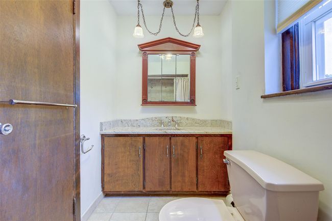 Bathroom featuring vanity and tile patterned floors | Image 30