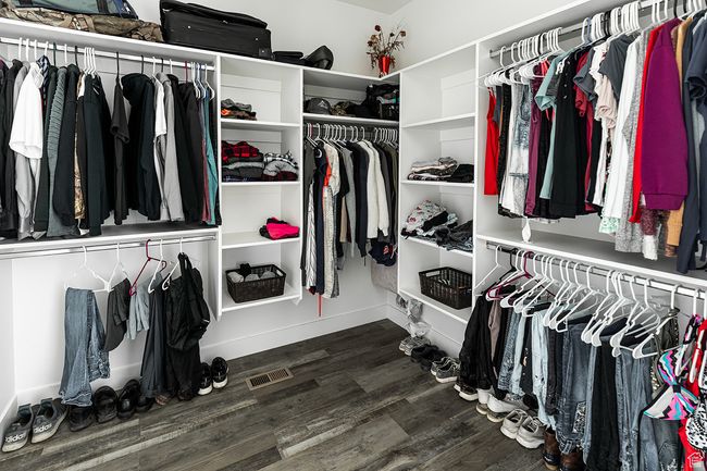 Walk in closet featuring wood finished floors and visible vents | Image 16