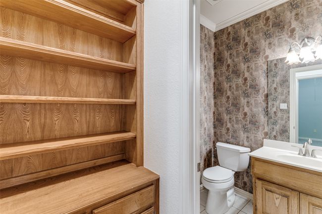 Half Bath with wood built in bookshelves in hallway | Image 24