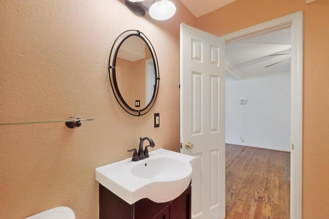 Bathroom with vanity and wood finished floors | Image 32