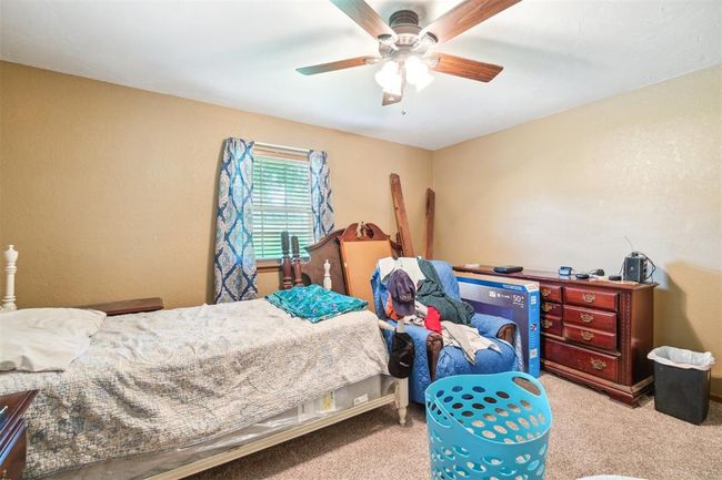 Bedroom with carpet and a ceiling fan | Image 21