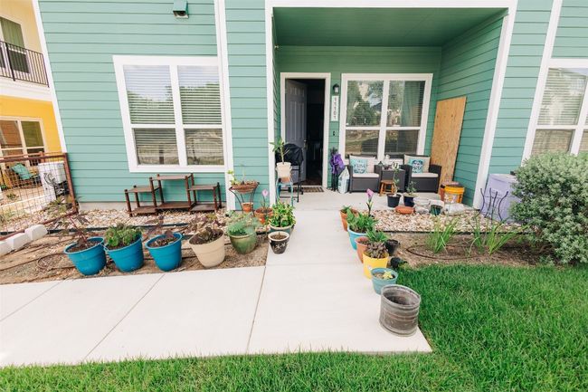Property entrance featuring an outdoor living space and a patio area | Image 6