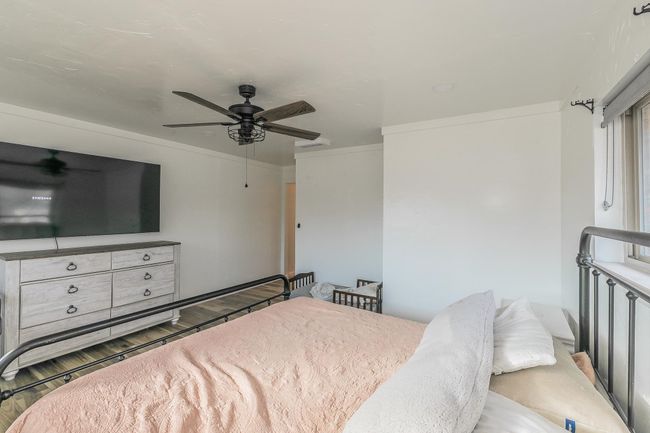 Bedroom featuring ceiling fan | Image 18