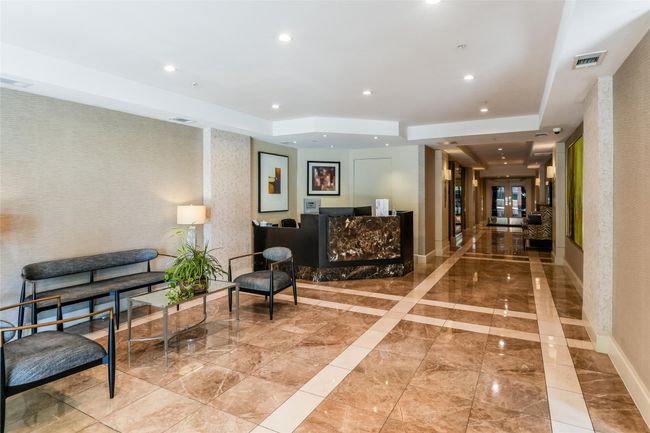 Community lobby with wallpapered walls and recessed lighting | Image 14