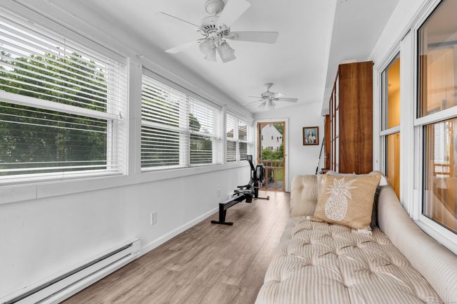 Heated Sunroom leads to Deck | Image 11