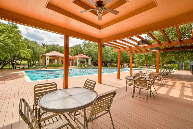 Pool featuring outdoor dining area, ceiling fan, and a pergola | Image 33