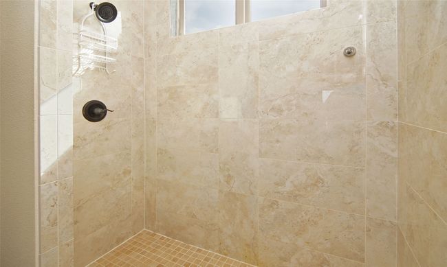 Bathroom featuring a tile shower | Image 25