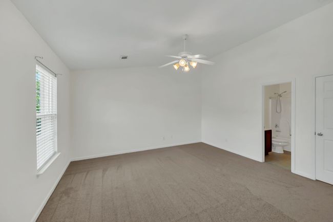 Other side of the main bedroom with the ensuite bathroom off to the right | Image 20