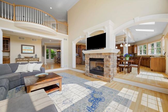 This view of the sunken family room shows the catwalk above. The high ceilings provide for an open airy feeling in this fabulous room. | Image 12
