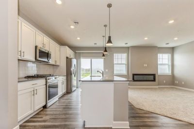 (Photo of an inventory home, actual homes finishes will vary) Modern and functional, the kitchen is sure to impress. | Image 2