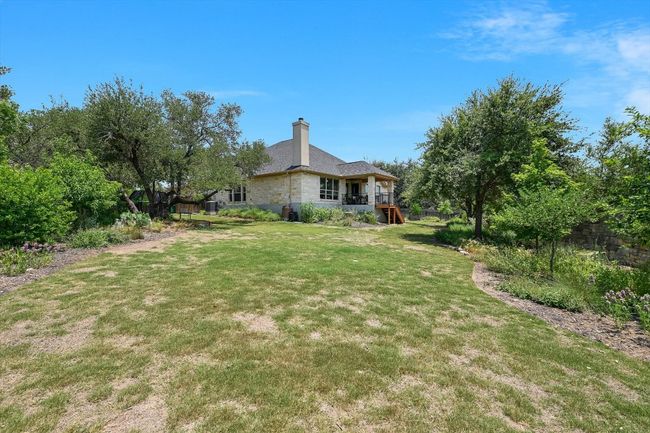View of grassy yard with stairs and a deck | Image 25