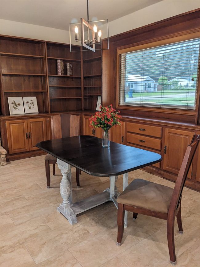 Dining room featuring a chandelier | Image 15