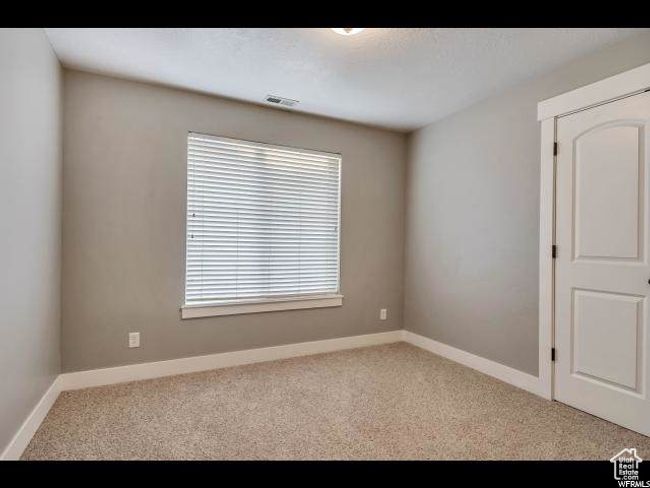 Carpeted empty room with baseboards | Image 10