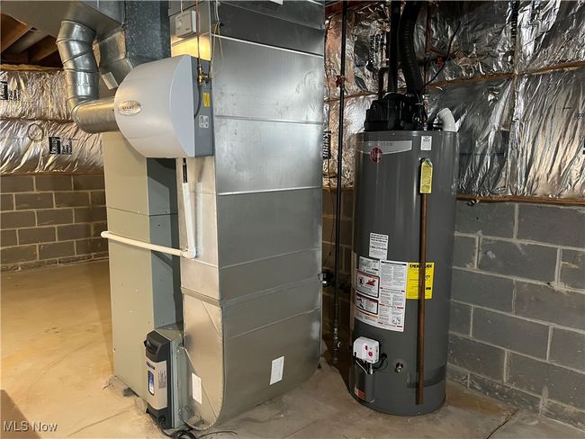 Utility Room with Furnace (2015) and Hot Water Tank (2024) | Image 40