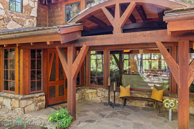 A few steps down from guest parking is a magnificent custom-made front door. Magic waits inside. | Image 4