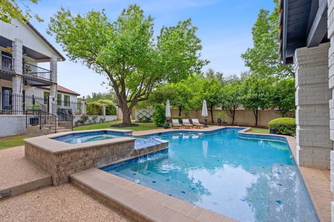 Sparkling swimming pool featuring a fully fenced in pool, in ground hot tub | Image 33