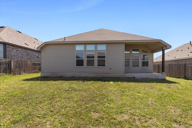 Back of property featuring a fenced backyard and a yard | Image 24