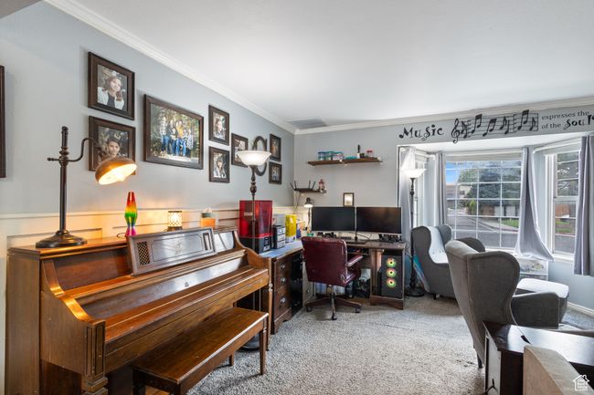 Carpeted home office with ornamental molding and a wainscoted wall | Image 16