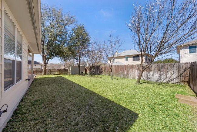 View of yard with an outbuilding, a fenced backyard, and a storage shed | Image 20