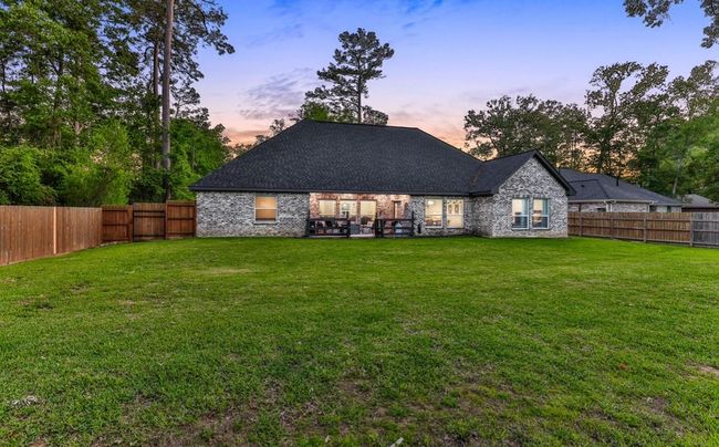 Rear of the home with plenty of room for a pool | Image 44