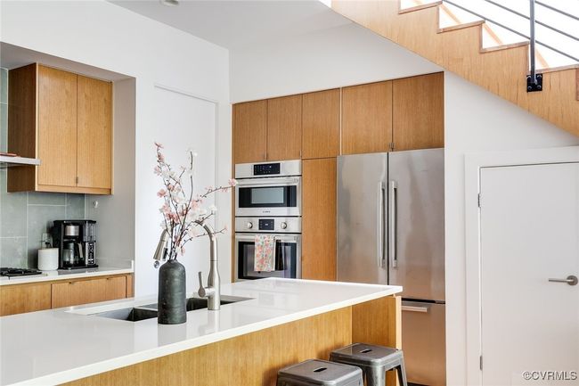 The central quartz island is the heart of the home. | Image 17