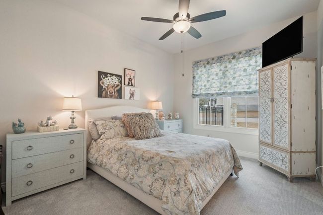 Bedroom featuring carpet floors, ceiling fan, and baseboards | Image 23