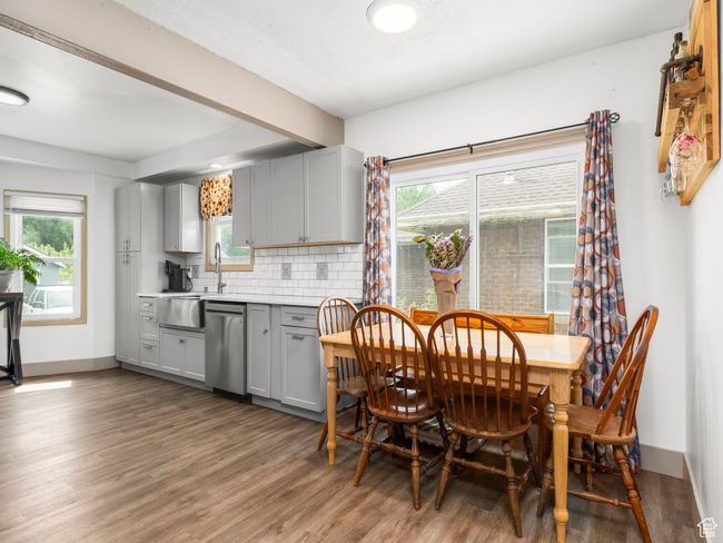 Dining space featuring wood finished floors and baseboards | Image 5