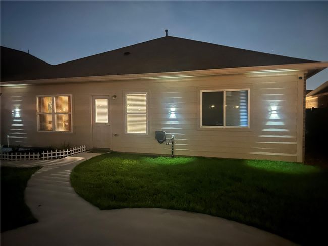 Backyard with lots of lighting. | Image 31
