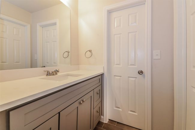 Bathroom featuring vanity and wood finished floors | Image 20