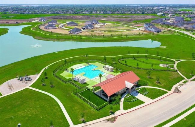 Experience breathtaking views of the serene lakes, lush parks, inviting pool, and modern clubhouse. | Image 25