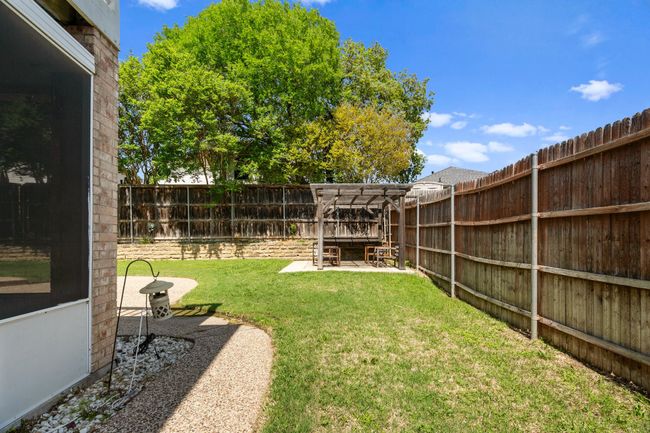 View of yard with a fenced backyard and a patio | Image 29