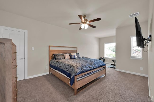 Bedroom 3 also faces the front of the home and includes an extended space perfect for a small workout space or study desk. This is the largest room upstairs. | Image 23