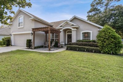 86213 Meadowwood Drive, Home with 4 bedrooms, 3 bathrooms and null parking in Yulee FL | Image 1