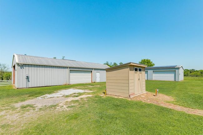 This photo shows the recent Well House and the Two 1, 800 square foot Barns/Workshops on the property. | Image 42