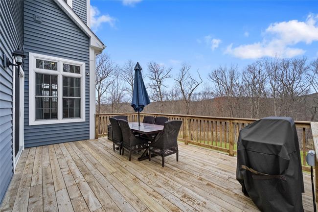 Deck featuring area for grilling and outdoor dining space | Image 35