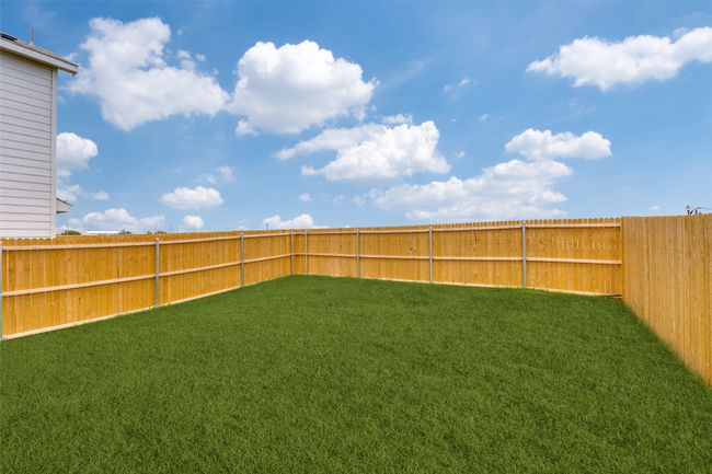 View of fenced backyard | Image 11