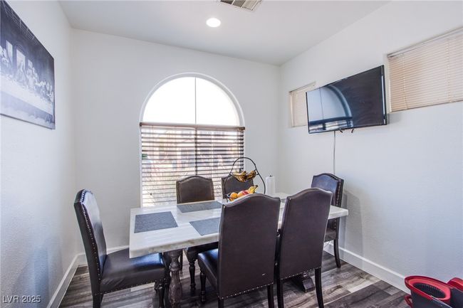 Dining area featuring wood finished floors, baseboards, and recessed lighting | Image 5