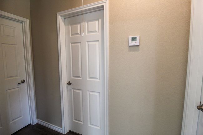 Hallway to both bedrooms and the second bathroom | Image 17