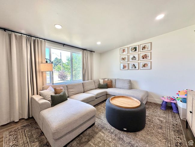Living area featuring wood finished floors and recessed lighting | Image 5