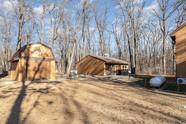 This view shows the backyard. There are two propane tanks (rented) - one for the main house and one for the custom workshop & garage. | Image 35