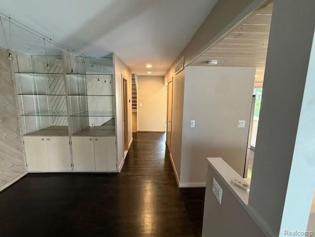 Hall featuring dark wood-style floors and baseboards | Image 12