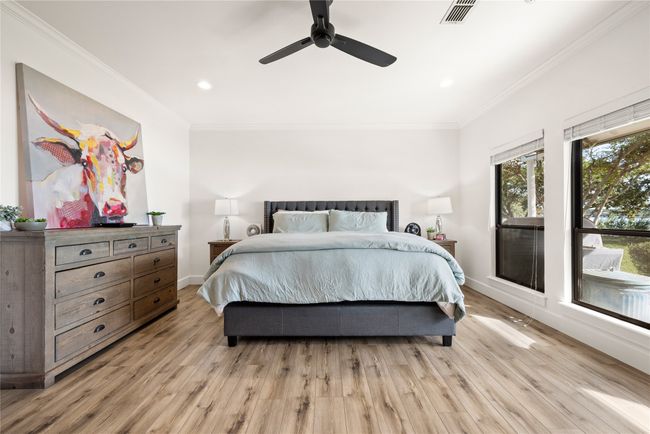 Bedroom with crown molding, light wood-style flooring, recessed lighting, and ceiling fan | Image 23