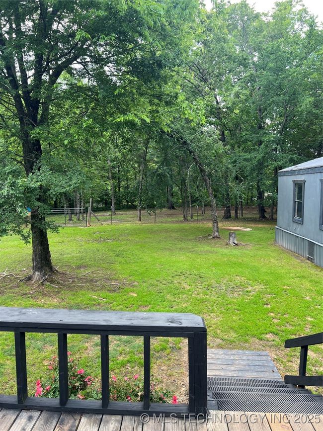 View of green lawn with a deck | Image 33