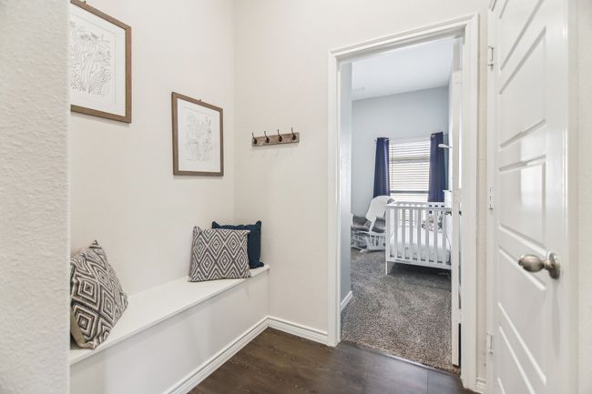 Corridor with baseboards and dark wood finished floors | Image 24