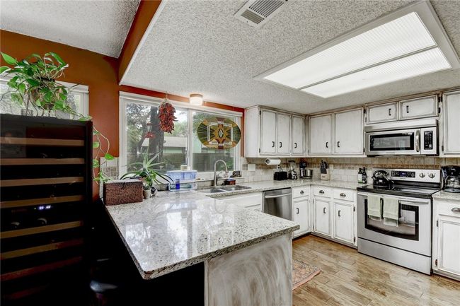 9001 Bubbling Springs Trl, House other with 4 bedrooms, 2 bathrooms and 4 parking in Austin TX | Image 7